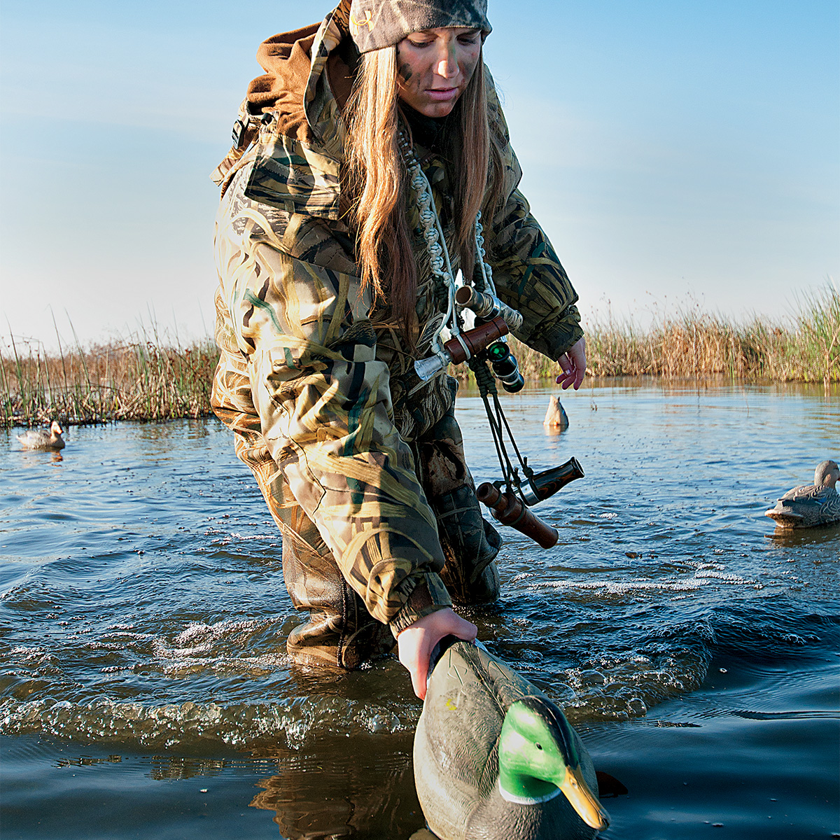 Waterfowl hunter placing decoys. Photo by James Leash/sharp-eyeimages.com